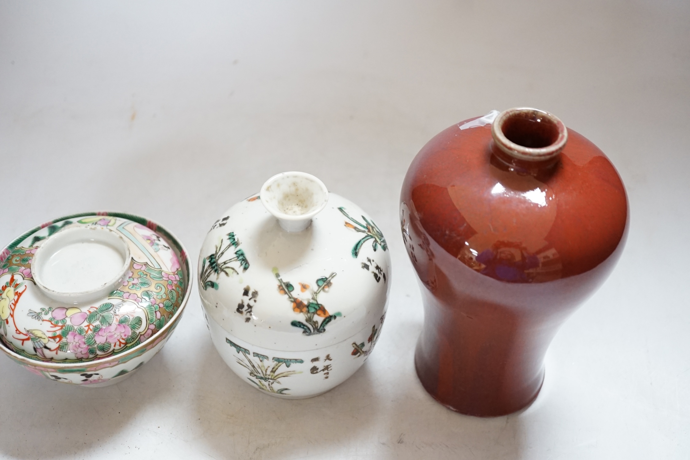 A Chinese sang de boeuf vase, 17.5cm high, and two others